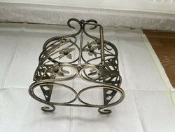 Fairy wrought iron wine rack with two glasses.