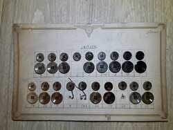 Antique shop button set in original eagle coat of arms paper storage, also excellent for period clothes