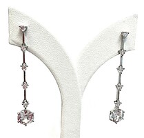 Dangling silver earrings with white stones