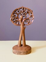 A uniquely marked sculpture with a tree of life couple in love made for a 60-year wedding anniversary