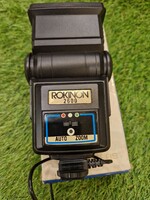 Vintage rokinon 2600 auto zoom flash with red, green, blue, transparent filters in original box.