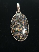 Opal pendant with a beautiful play set in 925 silver