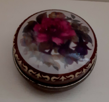 Metal medicated jewelry box with a rose floral pattern on it