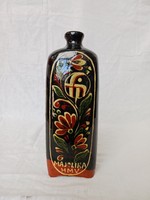 Brandy bottle decorated with market motifs
