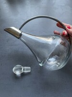Modern glass decanter with metal handle, spout