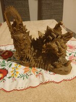 A dragon statue from Eastern Rêg is carved from suar wood. 27X27cm