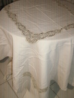 Elegant raw-colored tablecloth with a beautiful floral lace insert