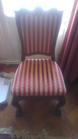 Antique upholstered chair with lion legs