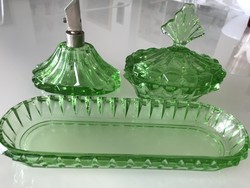 Antique toilet set made of bright green glass