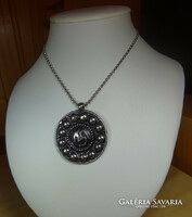 Om pendant made of alpaca, the necklace is made of medical steel. Special jewelry.