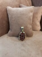 Silver pendant with garnets