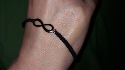 Handcrafted bracelet with a whimsical tear in the sign of eternal life, according to the pictures k 9.