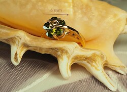 Gold-colored (goldfilled) ring with olive-green stones