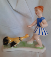 Glazed ceramic statue of a little girl from Bodrogkeresztúr with a rooster