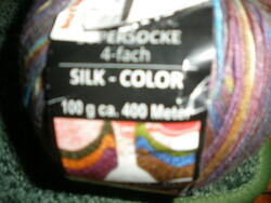 Silk yarn containing silk