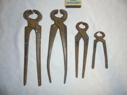 Four old, wrought iron pliers - together