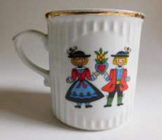 Vintage bohemian mug with a couple in Austrian folk costume and a view of the Melk Abbey