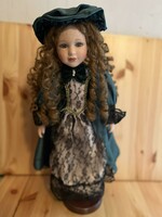 46cm vintage porcelain doll in green satin and lace dress