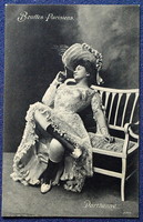 Antique spicy photo postcard of a smoking lady