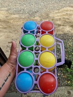 Retro ball game with holder.