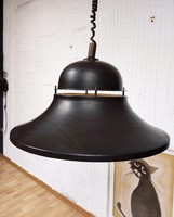 An industrial-style pendant designed by Béla Nádas