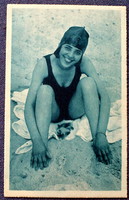 Old spicy photo postcard of a cheerful lady in a swimsuit