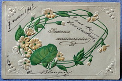 Antique art nouveau embossed litho greeting card with a stylized flower