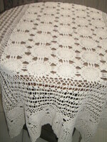 Hand-crocheted tablecloth with antique ecru art nouveau features