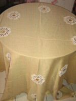Beautiful hand-crocheted tablecloth with embroidered flower inserts and fringed edges