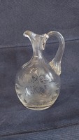 Polished, etched old glass spout