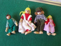 Wooden toy figures together with the family