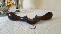 Old, curved, thick wooden hanger