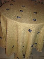 Beautiful elegant ecru hand-embroidered woven tablecloth with lace edges