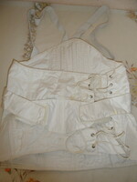 Older white textile medical corset