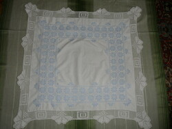 Hand-embroidered tablecloth with a lace border