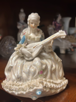 Porcelain baroque aristocrat lady with guitar in lace dress