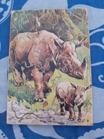Puzzle - retro wood-based framed puzzle with uniquely shaped elements complete with rhinoceros