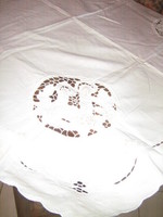 Beautiful tablecloth with a special snow-white riceli pattern embroidered with gold in four corners