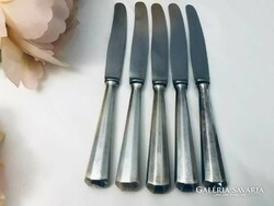 Knives with silver handles.
