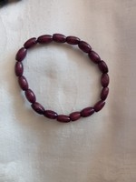 1 dark brown wooden (pearl) bracelet