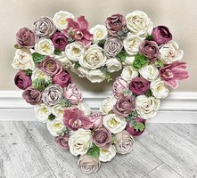 A beautiful giant heart with flower decorations and silk flowers