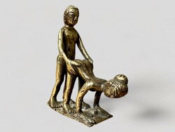 Old copper or bronze erotic statue man woman couple