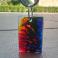 Fire and water battle resin cuboid pendant