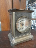 Old mechanical table alarm travel clock.