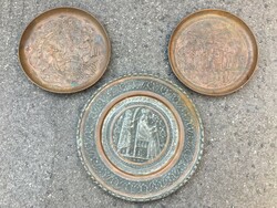 Three decorative metal plates