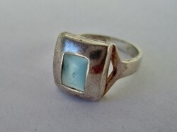 A special silver ring with a blue cat's eye stone