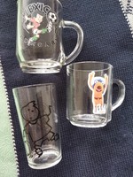 3 glass glasses and a mug together