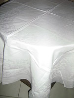 A beautiful baroque patterned pink snow-white damask tablecloth with Anjou-lilies