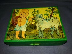 Old cube puzzle picture puzzle with the box with the story of the little boy and the lamb according to the pictures