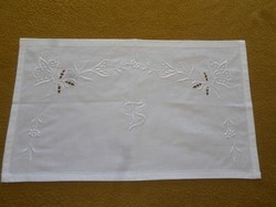 Snow white embroidered, monogrammed shelf cover.